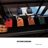 Aoyama Daruma leather charm 革 御守り